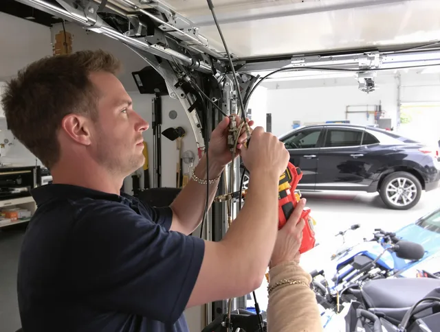 Miami Gardens Garage Door Repair safety certified technician performing cable replacement in Miami Gardens