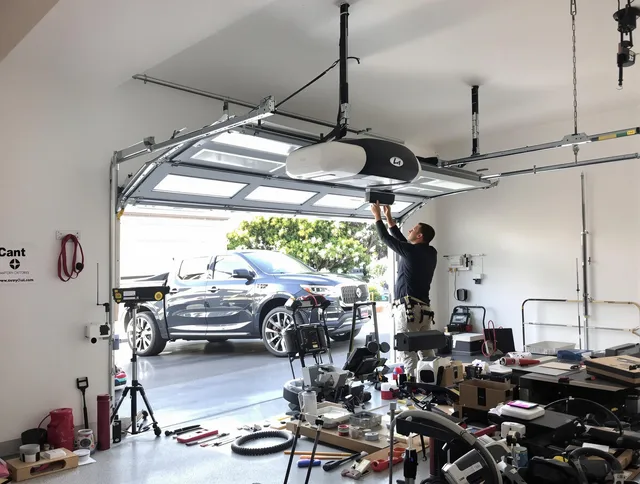 Miami Gardens Garage Door Repair specialist installing smart garage door opener system in Miami Gardens home